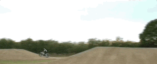 Animated GIF from the “Mission Impossible” promo showing Tom Cruise repeatedly jump a motorocycle on a motocross track.