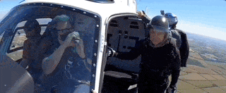 Animated GIF from the “Mission Impossible” promo showing Tom Cruise sky dive from a helicopter.
