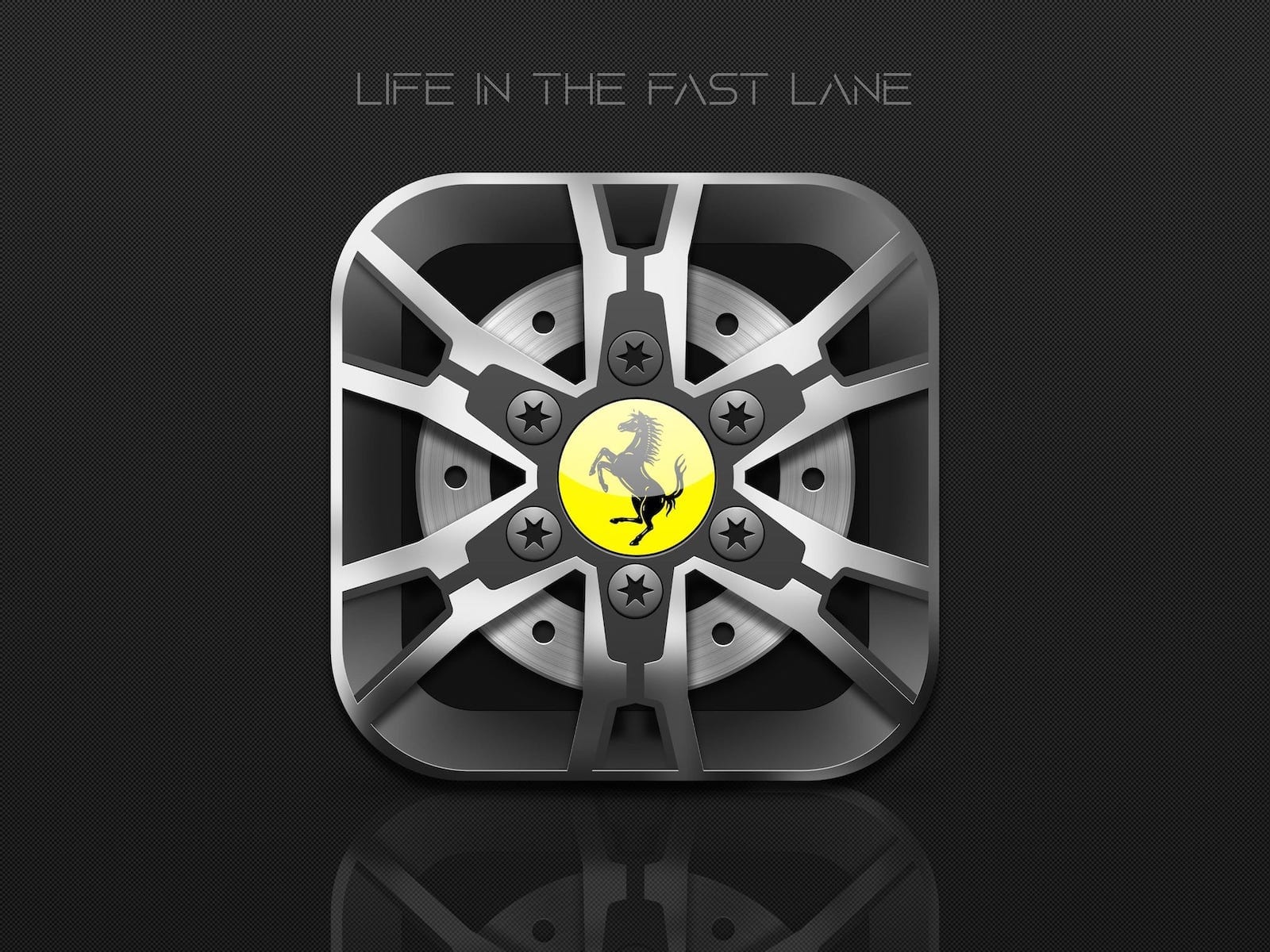 App icon in the form of a Ferrari rim with the words “Life in the fast lane” above it.