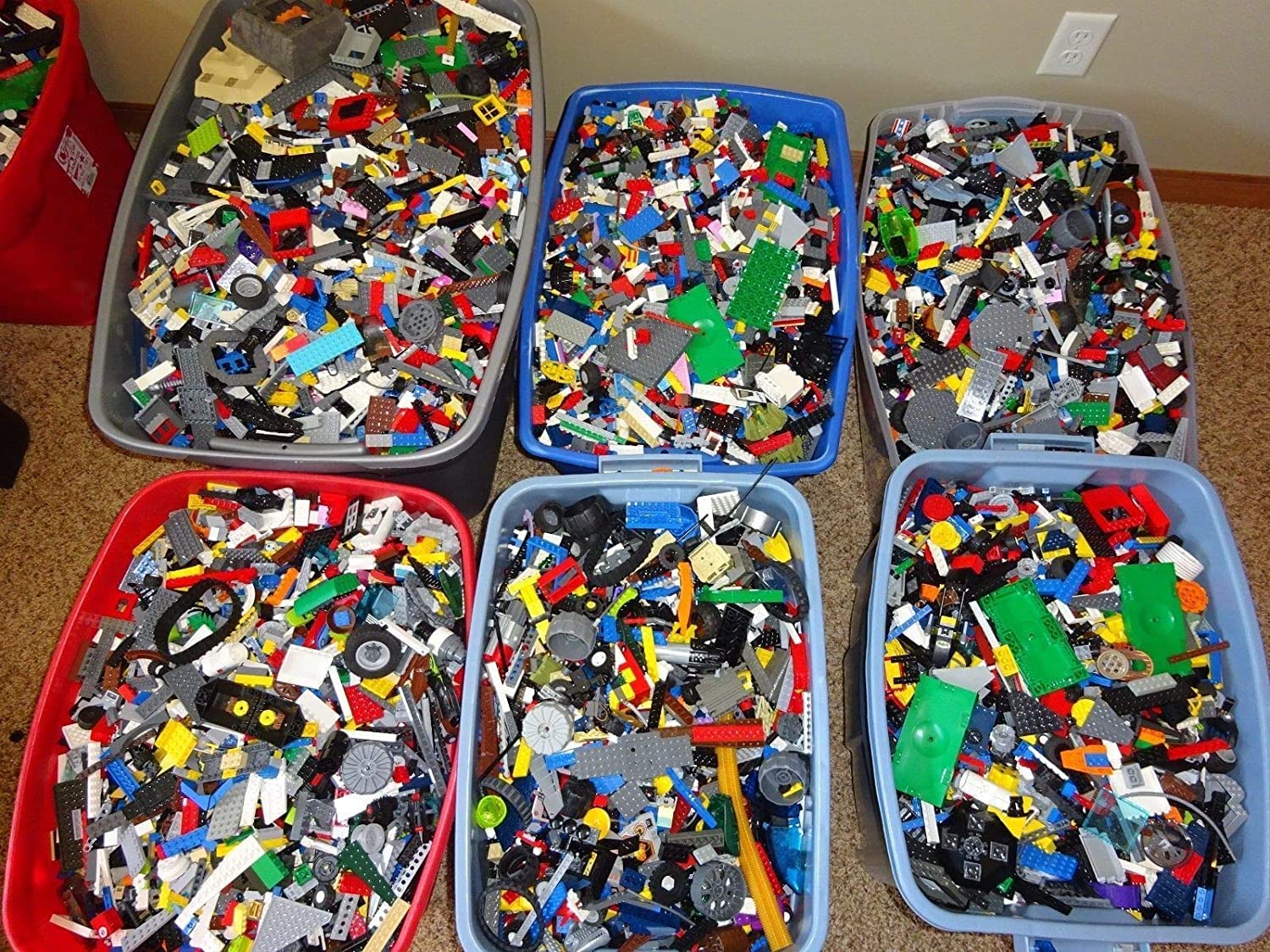 Photograph of 6 giant buckets of random legos.