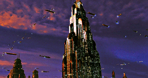 Animated gif showing the planet Coruscant from 'Star Wars' with lots of spaceship traffic traversing the sky.