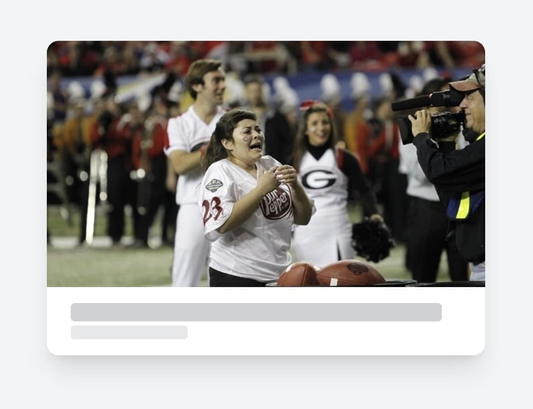 Screenshot of a shared link preview user interface, where the image depicts a woman, wearing a white Dr Pepper jersey with the number 23, appears emotional and ecstatic as she stands on a football field during a competition. In front of her, there are footballs and large containers used for a throwing challenge. A cameraman captures her reaction, while cheerleaders and a crowd of spectators in the background cheer her on. The atmosphere is lively and celebratory, suggesting she may have won or completed a successful challenge.